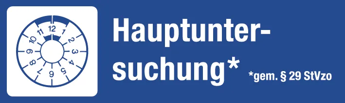 Hinweisschild „Hauptuntersuchung gemäß § 29 StVZO“ mit Prüfplakette.